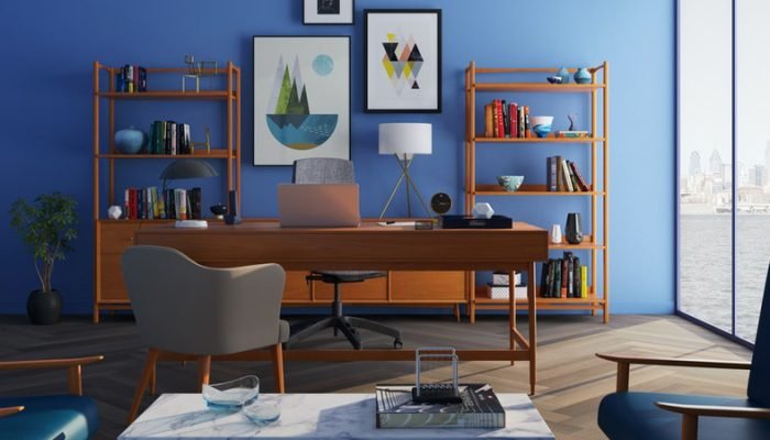 brown-wooden-desk-with-rolling-chair-and-shelves-near-window